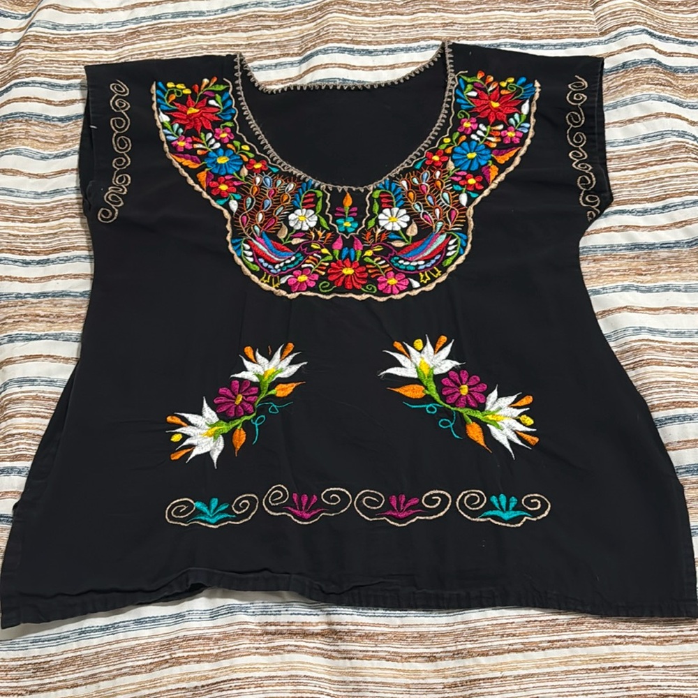 Black embroidered top.